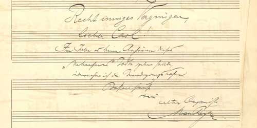 Zu sehen ist ein Notenblatt mit einer handschriftliche Widmung.