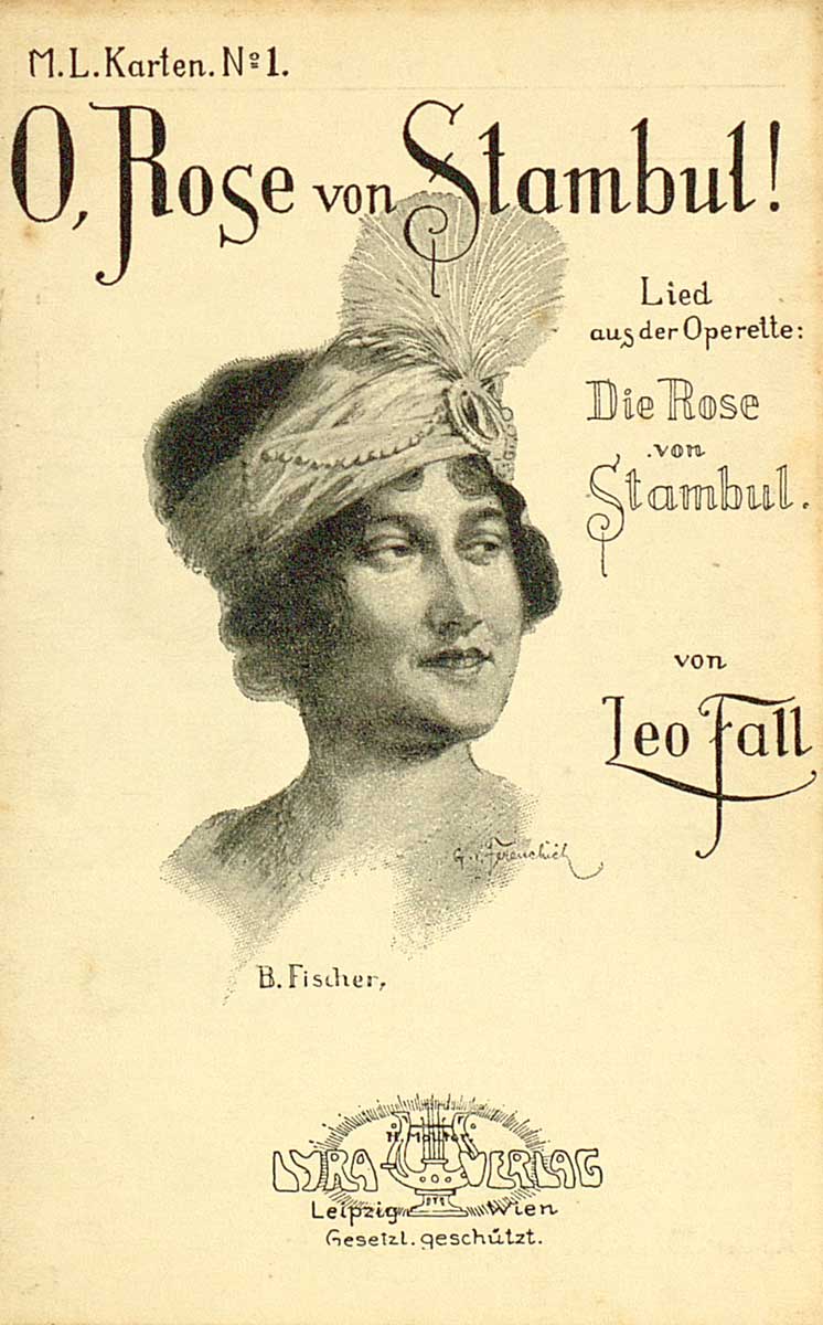 © Badische Landesbibliothek Karlsruhe Zu sehen ist die Vorderseite einer Postkarte zur Operette "Die Rose von Stambul" mit dem Bildnis der Schauspielerin Betty Fischer als türkisches Mädchen mit reich geschmücktem Stirnband und Zierfeder.
