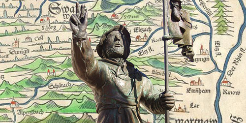 Statue von Joß Fritz am Joß-Fritz-Brunnen in Untergrombach vor der im 16. Jahrhundert entstandenen Schwarzwaldkarte Silva Nigra des Kartographen Sebastian Münster (1488–1552, BLB, Go 88 cart)